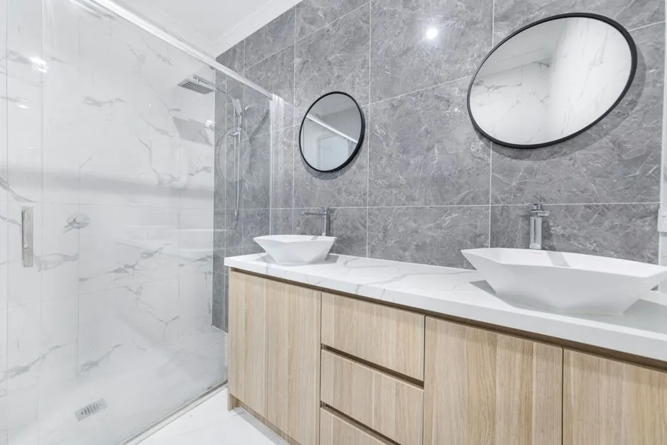 Bathroom with a walk-in shower, grey marble-effect tiles and a double vanity unit